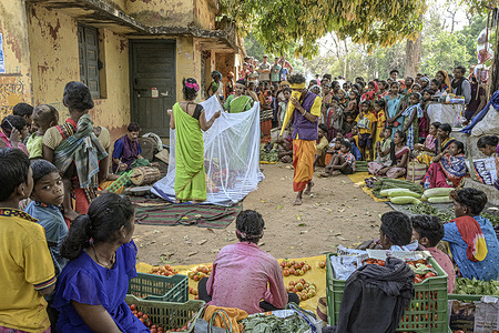 Theatre artists perform a street play on malaria awareness at a Haat Bazaar in Mutanpal village in Bastar District of Chhattisgarh, India